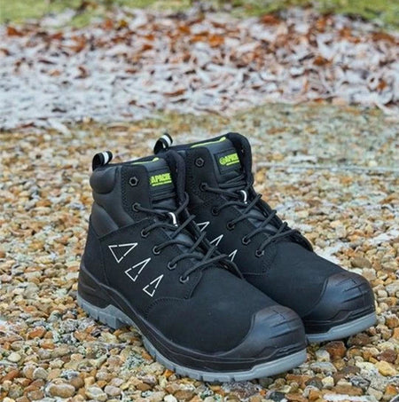 Apache ARMSTRONG Unisex Boots Black side view showcasing lace-up design and rubber sole on a gravel surface.