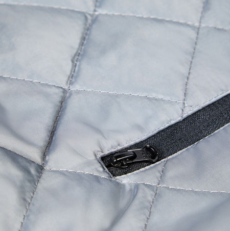 Apache ATS Mens Waterproof Coat Black detail view of the zipper on the jacket showing the quilted fabric.