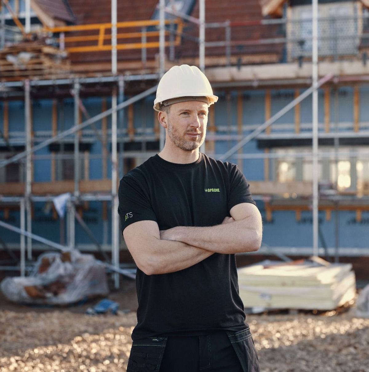 Apache DELTA Mens Workwear T-Shirt Black front view on a model at a construction site.