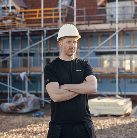 Apache DELTA Mens Workwear T-Shirt Black front view on a model at a construction site.