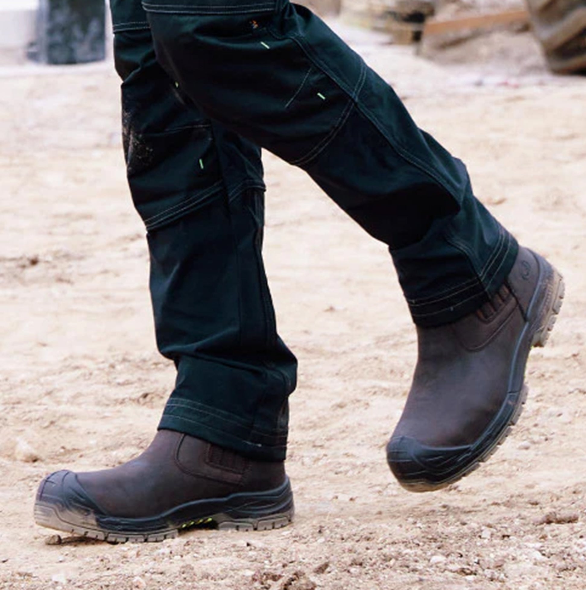 Apache WABANA Unisex Dealer Boots Brown side view worn by person walking on dirt surface.