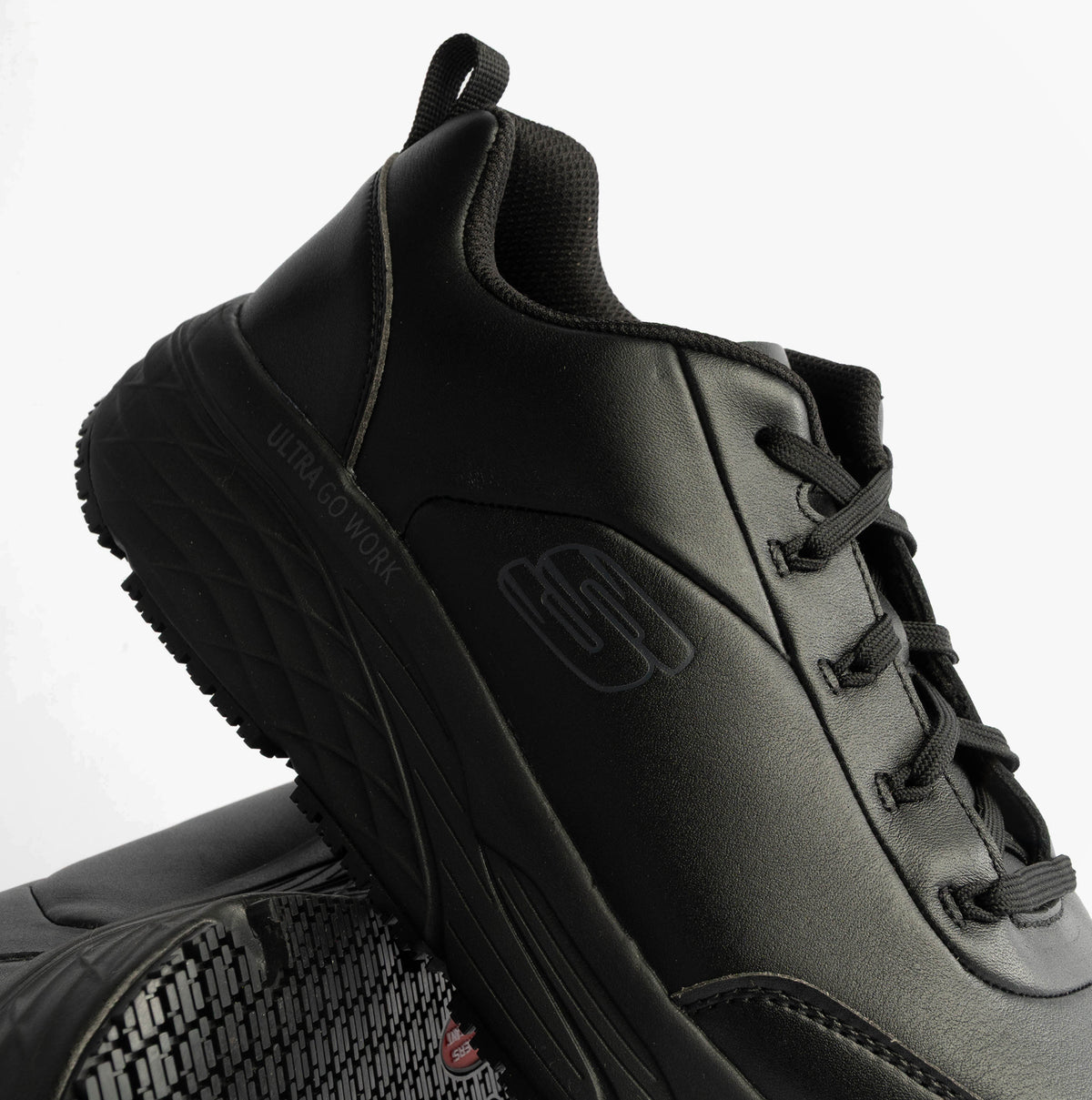 Skechers MAX CUSHIONING ELITE SR-FILCH Mens Workwear Trainers Black side view showing sleek black design and lace-up closure.